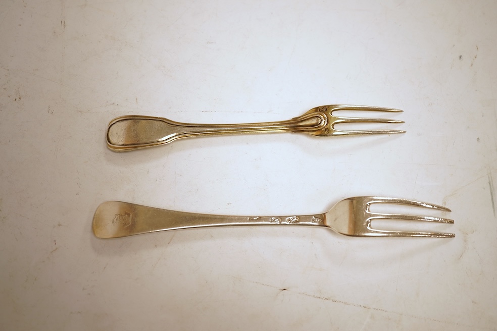 A collection of assorted mainly 18th century silver three pronged table forks, including a pair of dog nose, 19.1cm, most with indistinct or rubbed marks, together with a similar collection of thirteen silver three prong